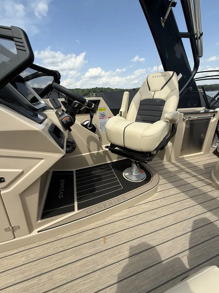 Slide: The Image of Interior of 2025 Sylvan G3 DLZ Bar with luxurious captain's chair. - 6