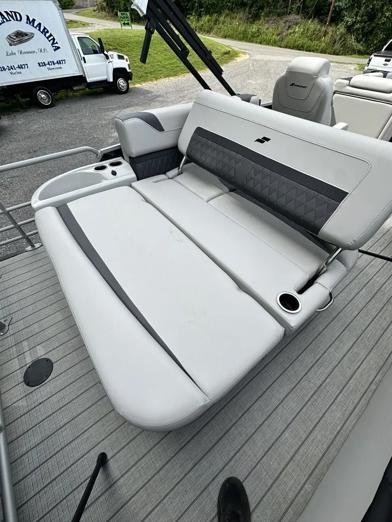 Slide: The Image of 2024 Starcraft CX 23 Q DH boat with luxurious seating area. - 12