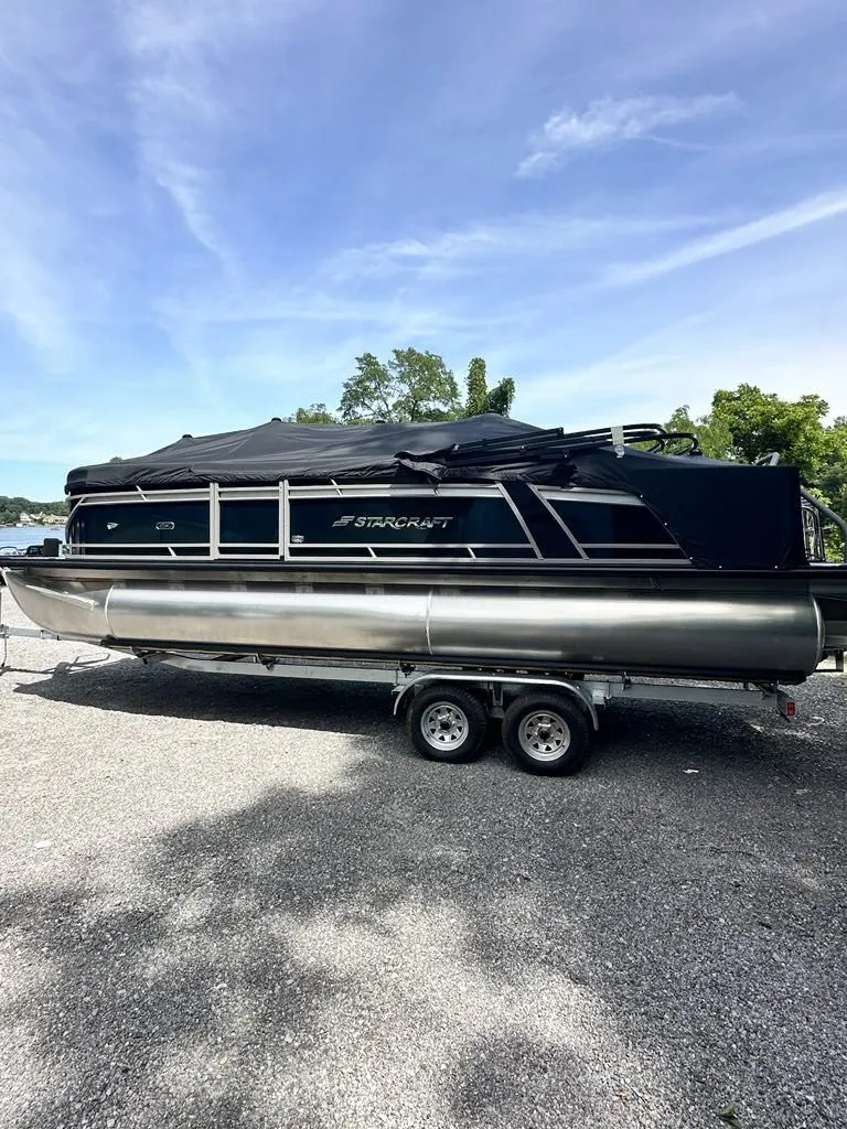Slide: The Image of 2024 Starcraft CX 23 Q DH pontoon boat on trailer. - 6