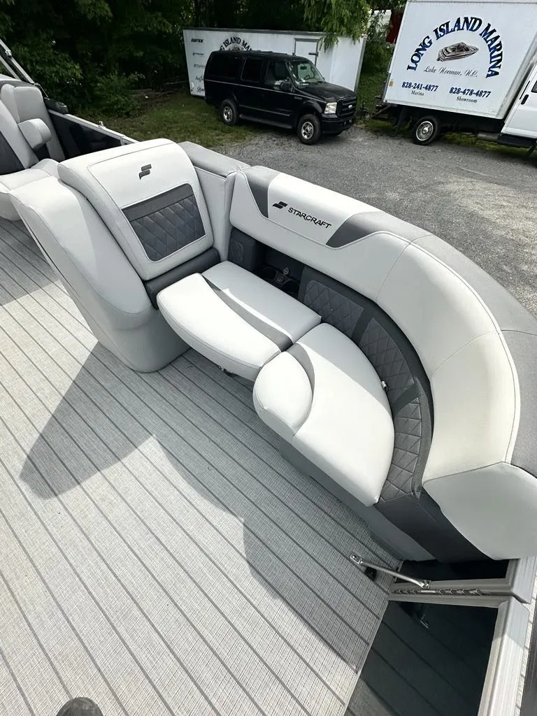 Slide: The Image of 2024 Starcraft CX 23 Q DH boat with luxurious gray seating. - 8