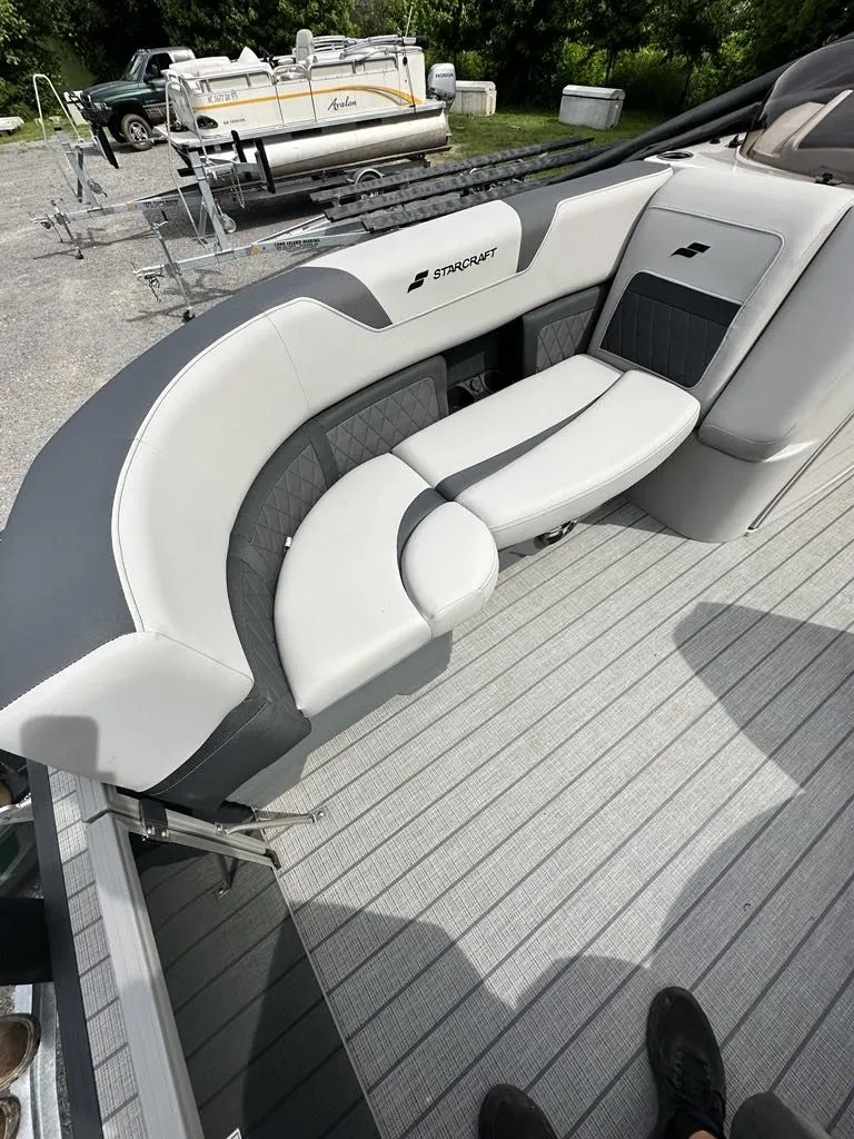 Slide: The Image of 2024 Starcraft CX 23 Q DH boat with luxurious seating. - 9