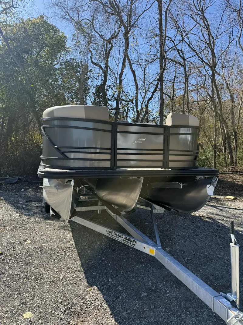 Slide: The Image of 2026 Starcraft EXS-3 DL pontoon boat on trailer outdoors. - 11