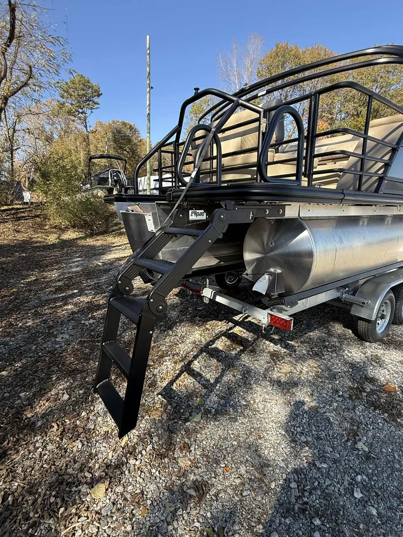 Slide: The Image of Starcraft EXS-3 DL 2026 pontoon boat with ladder on trailer. - 15