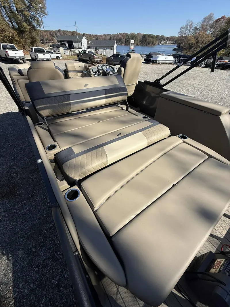 Slide: The Image of Starcraft EXS-3 DL 2026 boat with luxurious seating by the lake. - 20