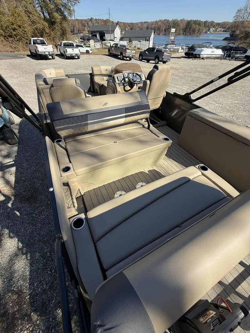 Slide: The Image of Starcraft EXS-3 DL 2026 pontoon boat with luxurious interior and lake view. - 8