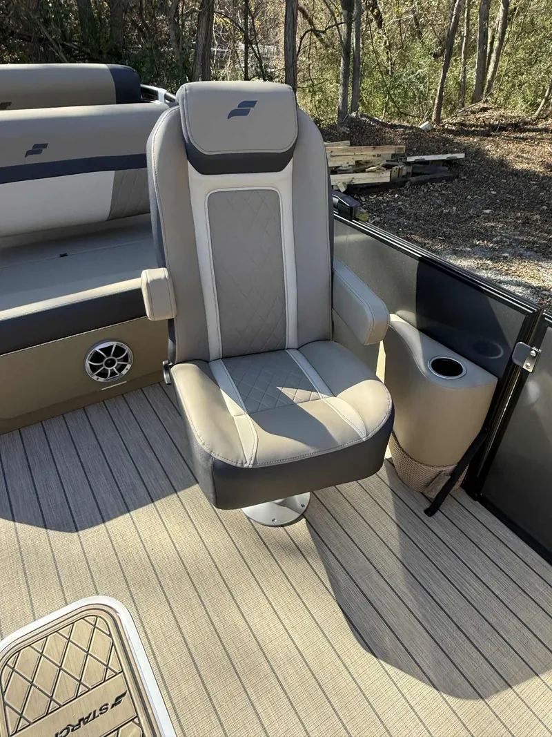 Slide: The Image of Starcraft EXS-3 DL 2026 boat seat with armrests and speaker. - 9
