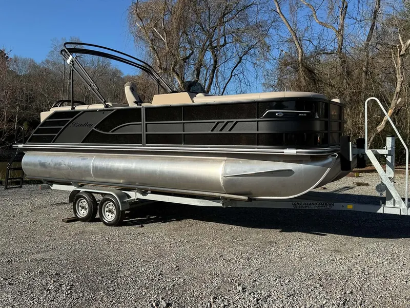 The Image of 2026 Bentley Pontoons Elite 223 Admiral on trailer outdoors. - 1