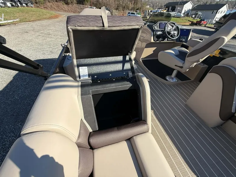 Slide: The Image of Interior of 2026 Bentley Pontoons Elite 223 Admiral with open storage compartment. - 25