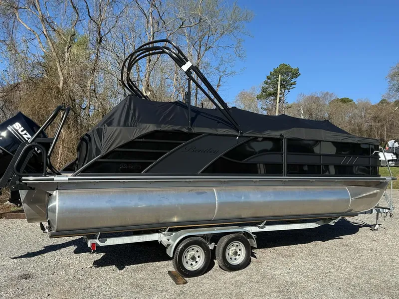 Slide: The Image of 2026 Bentley Pontoons Elite 223 Admiral on trailer, covered, outdoors. - 29