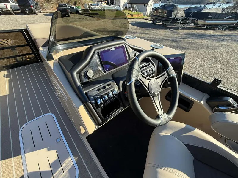 Slide: The Image of Interior of 2026 Bentley Pontoons Elite 223 Admiral with modern helm console. - 4