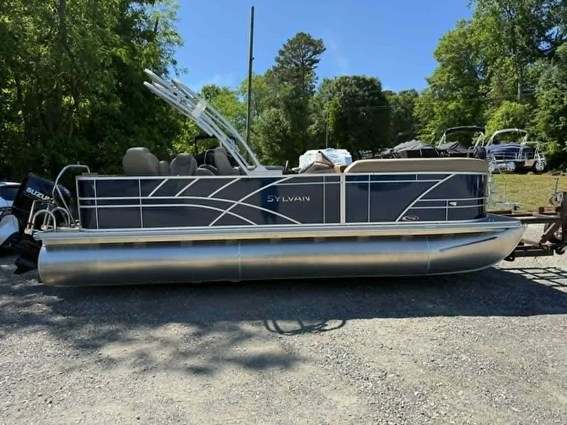 The Image of Sylvan Mirage 8522 Party Fish 2025 pontoon boat parked outdoors. - 1