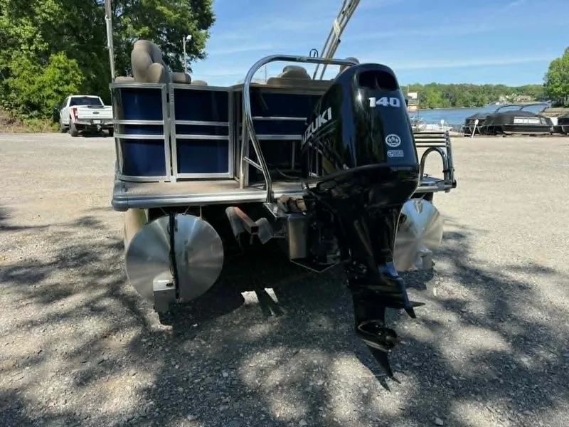 Slide: The Image of Sylvan Mirage 8522 Party Fish 2025 with Suzuki 140 engine by the lake. - 17