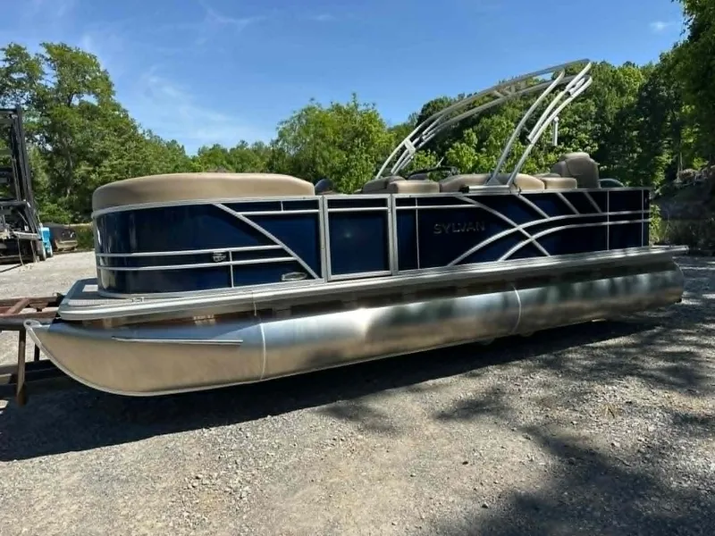 Slide: The Image of 2025 Sylvan Mirage 8522 Party Fish pontoon boat on gravel surface. - 29