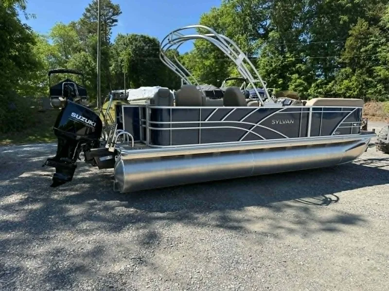Slide: The Image of 2025 Sylvan Mirage 8522 Party Fish pontoon boat parked outdoors. - 5