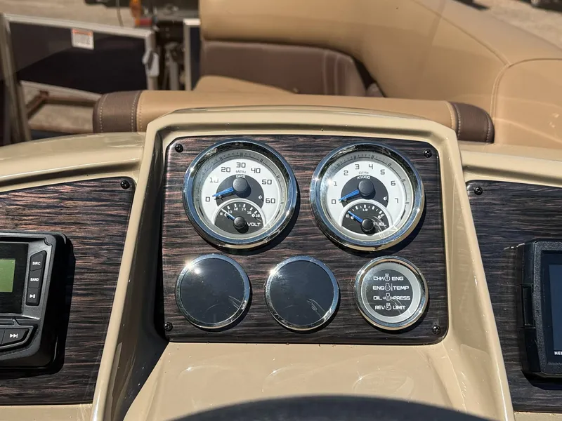 Slide: The Image of Dashboard of 2025 Sylvan Mirage 8522 Party Fish with speedometer and gauges. - 7