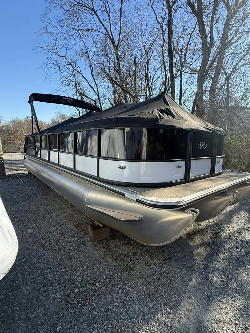 The Image of 2023 Bentley Pontoons Legacy 243 Swingback parked on gravel lot. - 1