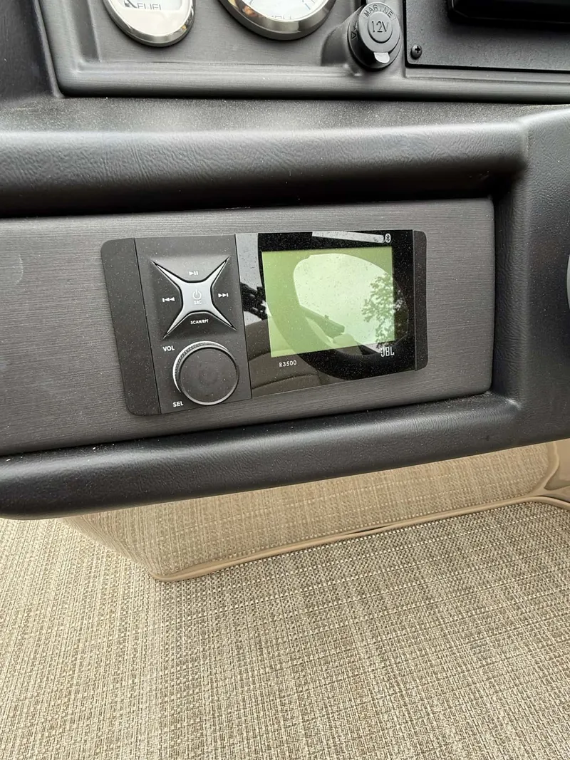 Slide: The Image of 2023 Bentley Pontoons Legacy 243 Swingback dashboard with JBL control. - 11