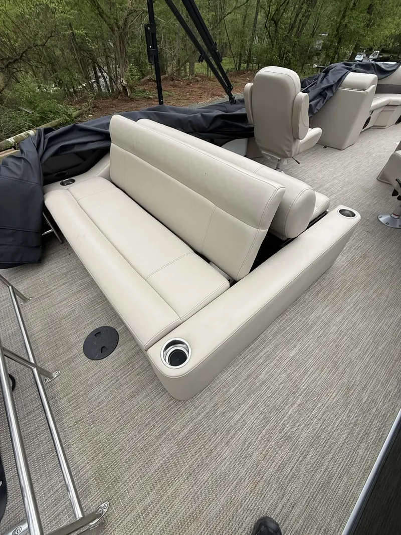Slide: The Image of 2023 Bentley Pontoons Legacy 243 Swingback interior with beige seating. - 15