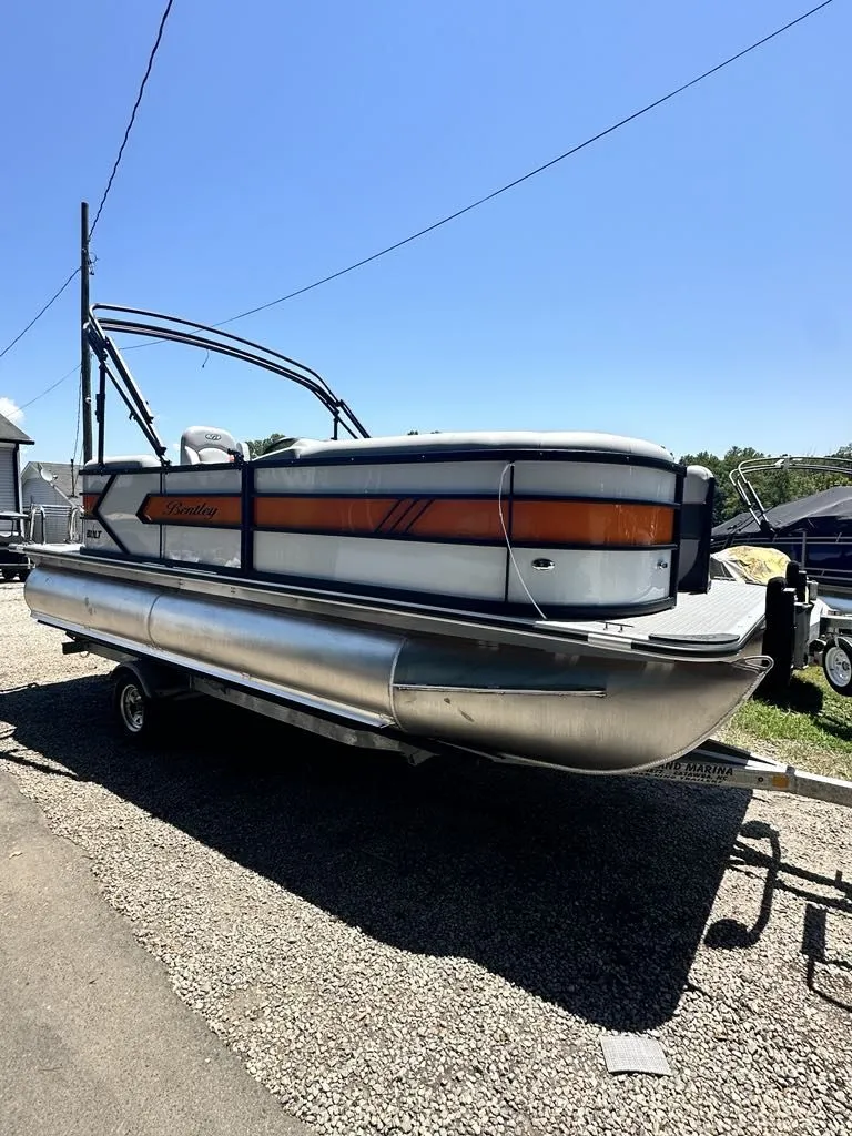 The Image of 2025 Bentley Pontoons Bentley Bolt on trailer, sunny day. - 1