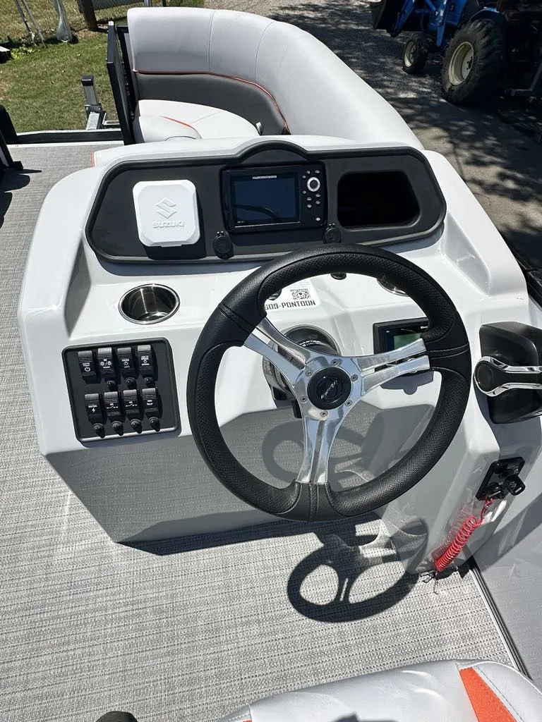 Slide: The Image of 2025 Bentley Pontoons Bentley Bolt helm with steering wheel and controls. - 5