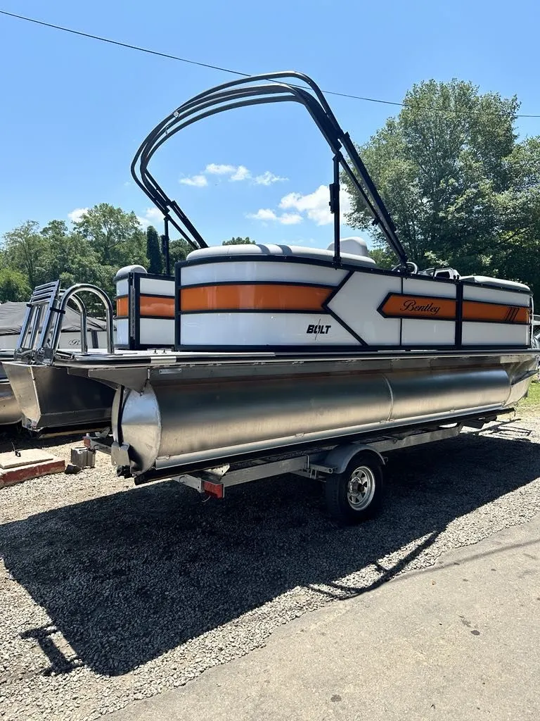 Slide: The Image of 2025 Bentley Pontoons Bentley Bolt on trailer, sunny day. - 7