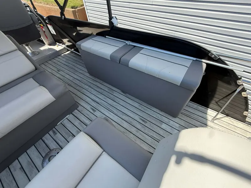 Slide: The Image of Interior of a 2017 Starcraft MX 25 boat with gray seating. - 14