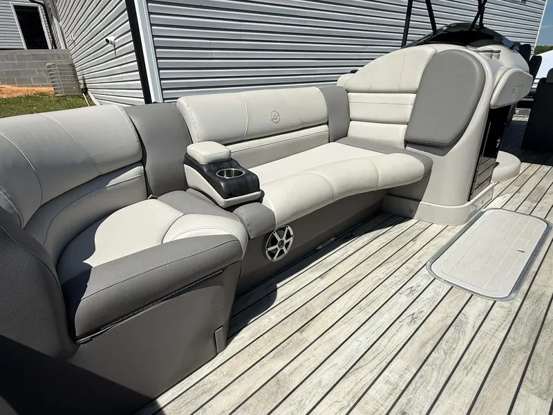 Slide: The Image of Interior of a 2017 Starcraft MX 25 boat with gray seating. - 16