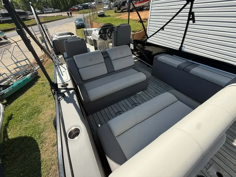 Slide: The Image of Interior of a 2017 Starcraft MX 25 pontoon boat with gray seating. - 21