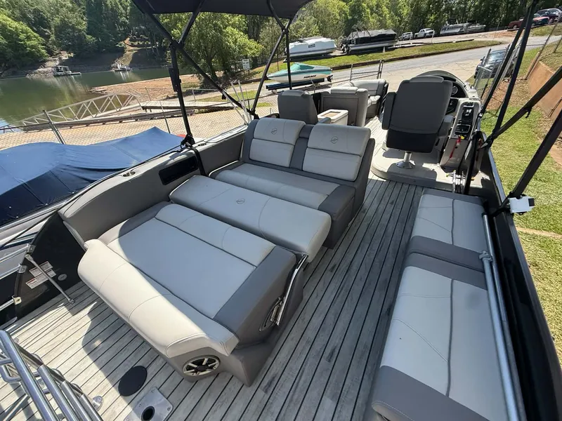 Slide: The Image of Interior of a 2017 Starcraft MX 25 pontoon boat with gray seating. - 3