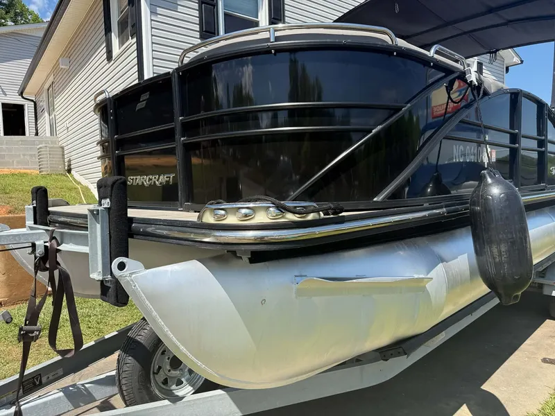 Slide: The Image of 2017 Starcraft MX 25 pontoon boat on trailer, side view. - 7