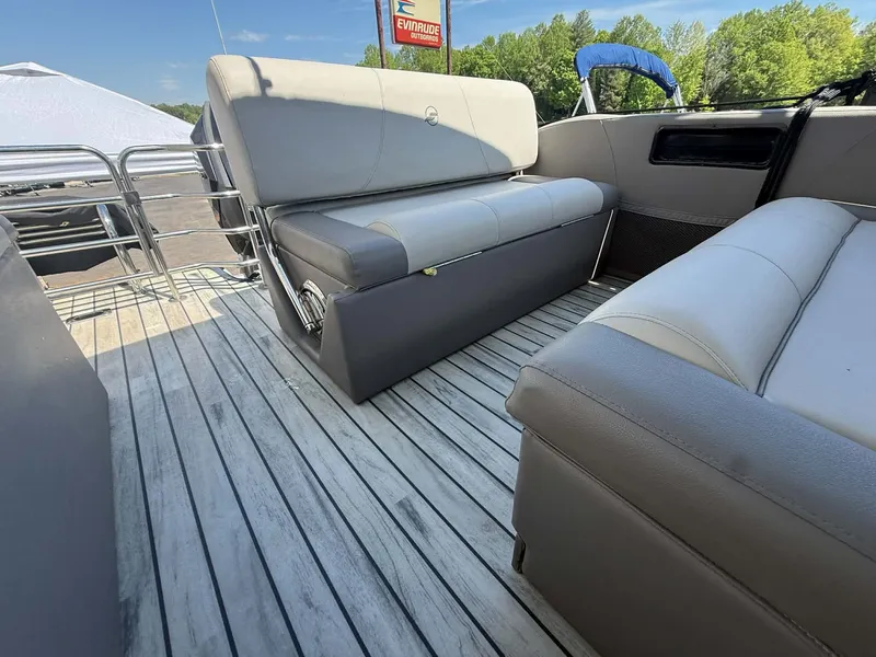 Slide: The Image of Interior of a 2017 Starcraft MX 25 boat with gray seating. - 8