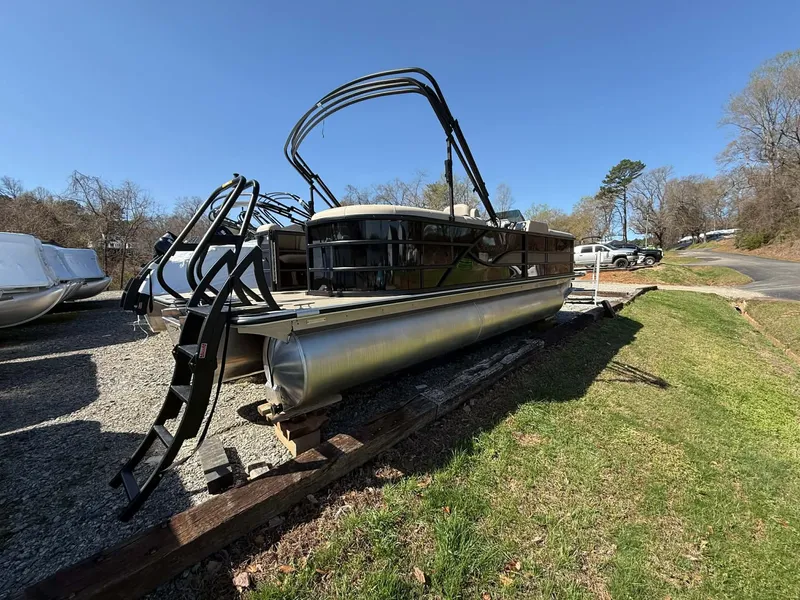 Slide: The Image of 2026 Bentley Pontoons Legacy 223 Navigator on a trailer outdoors. - 10