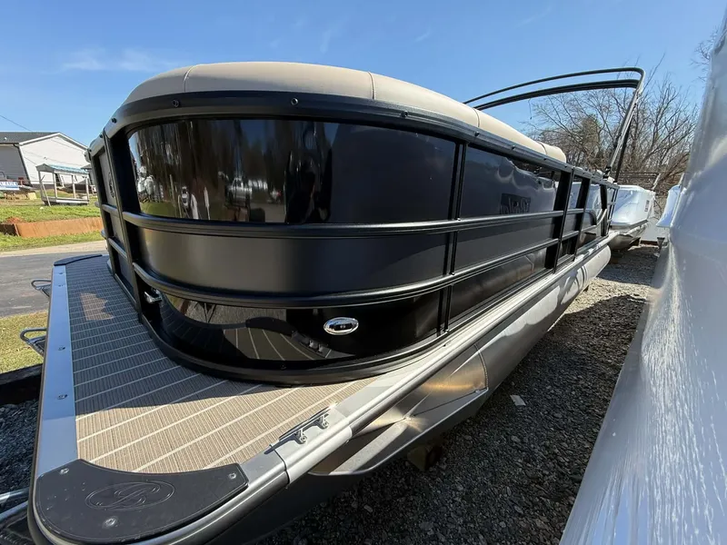 Slide: The Image of 2026 Bentley Pontoons Legacy 223 Navigator parked on gravel surface. - 15