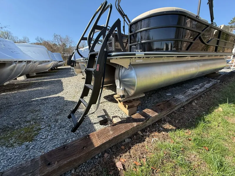Slide: The Image of 2026 Bentley Pontoons Legacy 223 Navigator on gravel lot. - 5