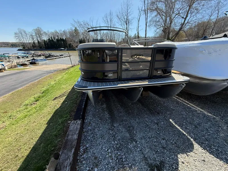 Slide: The Image of 2026 Bentley Pontoons Legacy 223 Navigator parked by the lakeside. - 6
