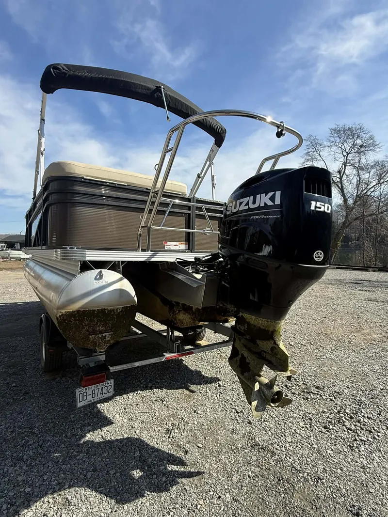 Slide: The Image of 2024 Crest Classic LX 200 pontoon boat with Suzuki 150 engine. - 13