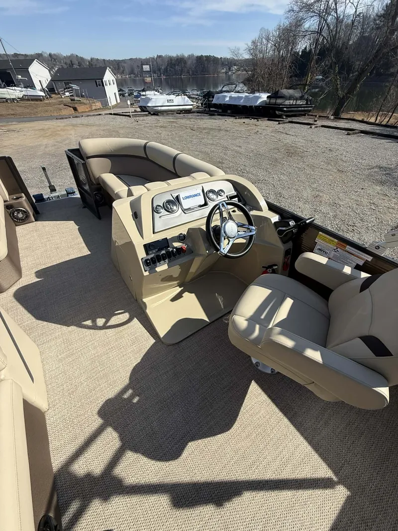 Slide: The Image of Interior of a 2024 Crest Classic LX 200 boat with helm console. - 3