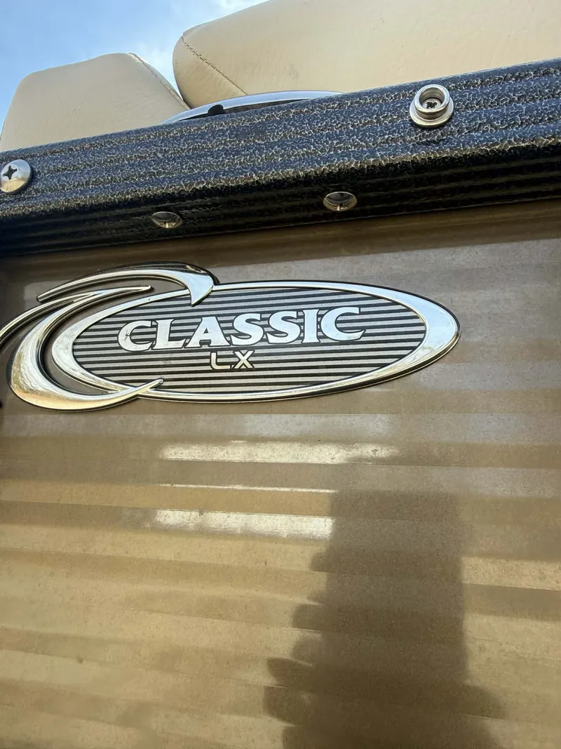 Slide: The Image of 2024 Crest Classic LX 200 logo on boat panel. - 7