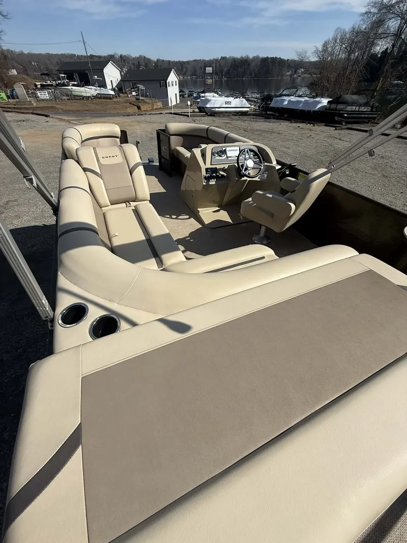 Slide: The Image of Interior view of a 2024 Crest Classic LX 200 pontoon boat. - 8