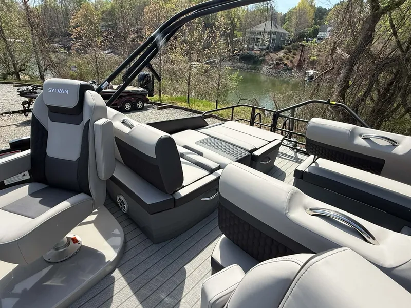 Slide: The Image of Interior of 2026 Sylvan L-3 RLZ pontoon boat by the lake. - 27
