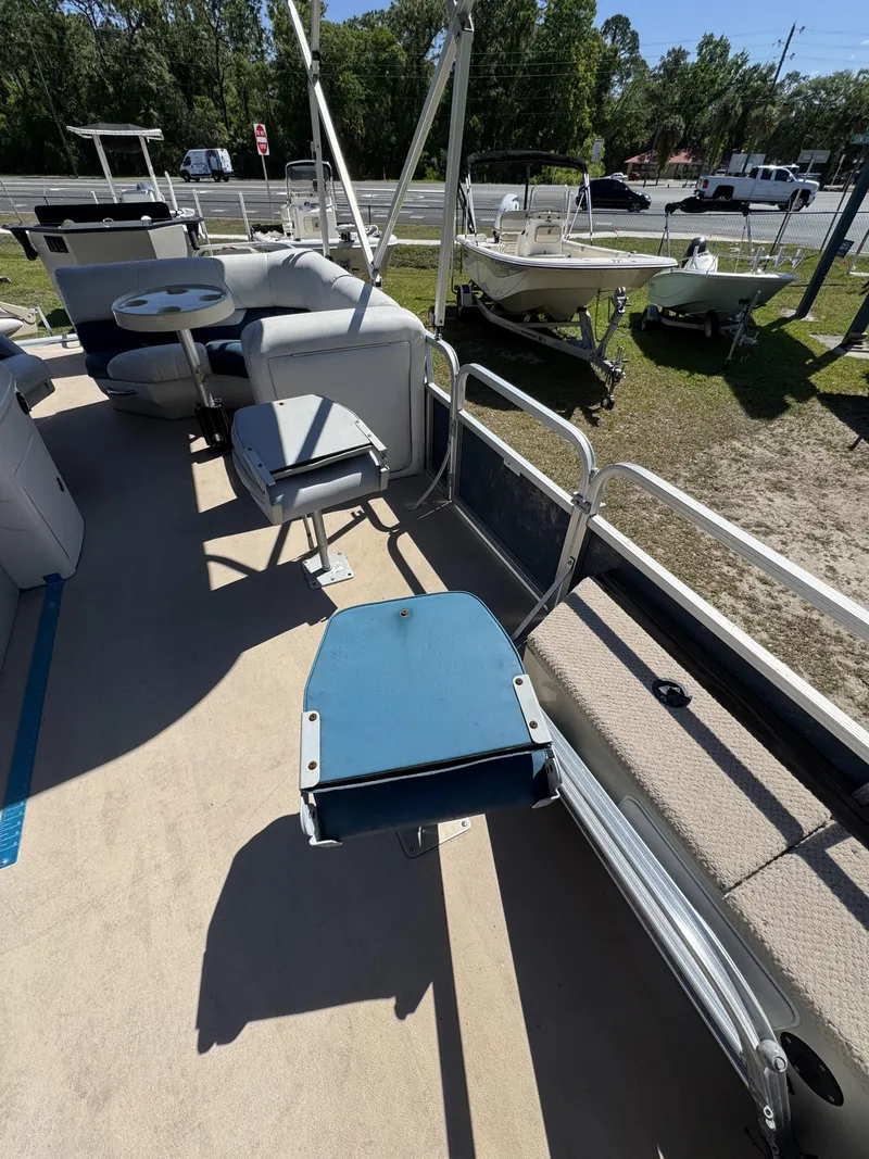 Slide: The Image of 2013 Lowe X214 Fish boat interior with seating area. - 10