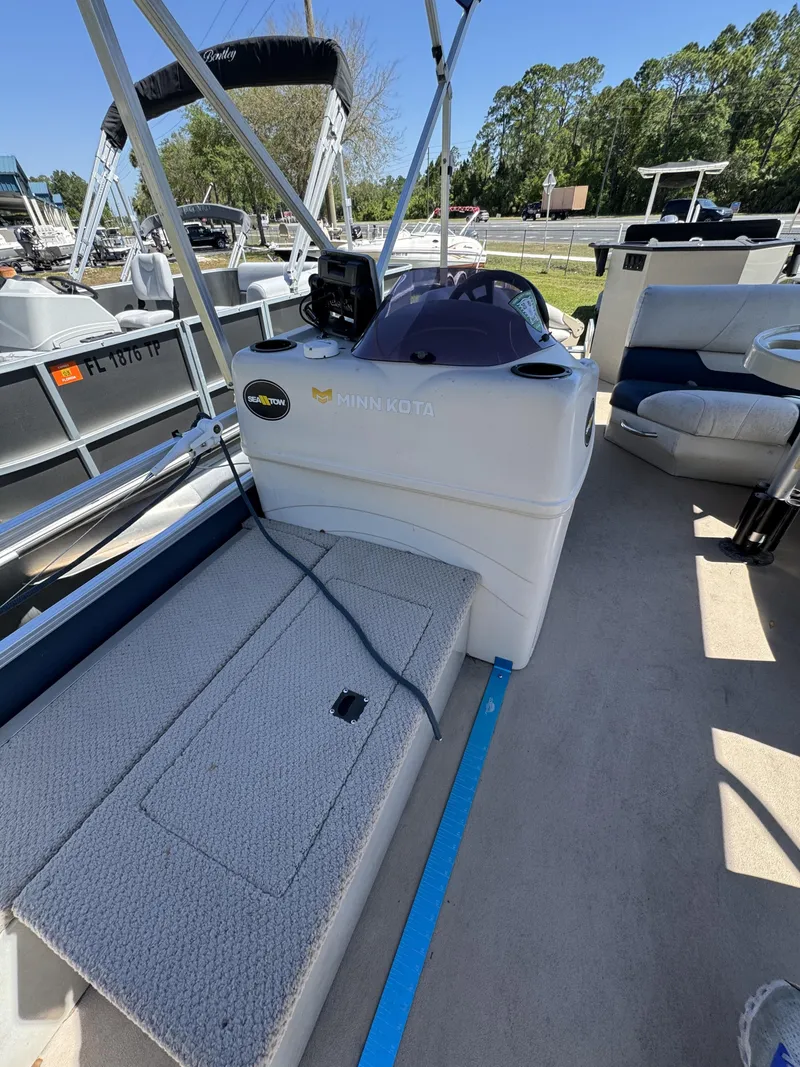 Slide: The Image of Interior of a 2013 Lowe X214 Fish boat with Minn Kota control. - 11