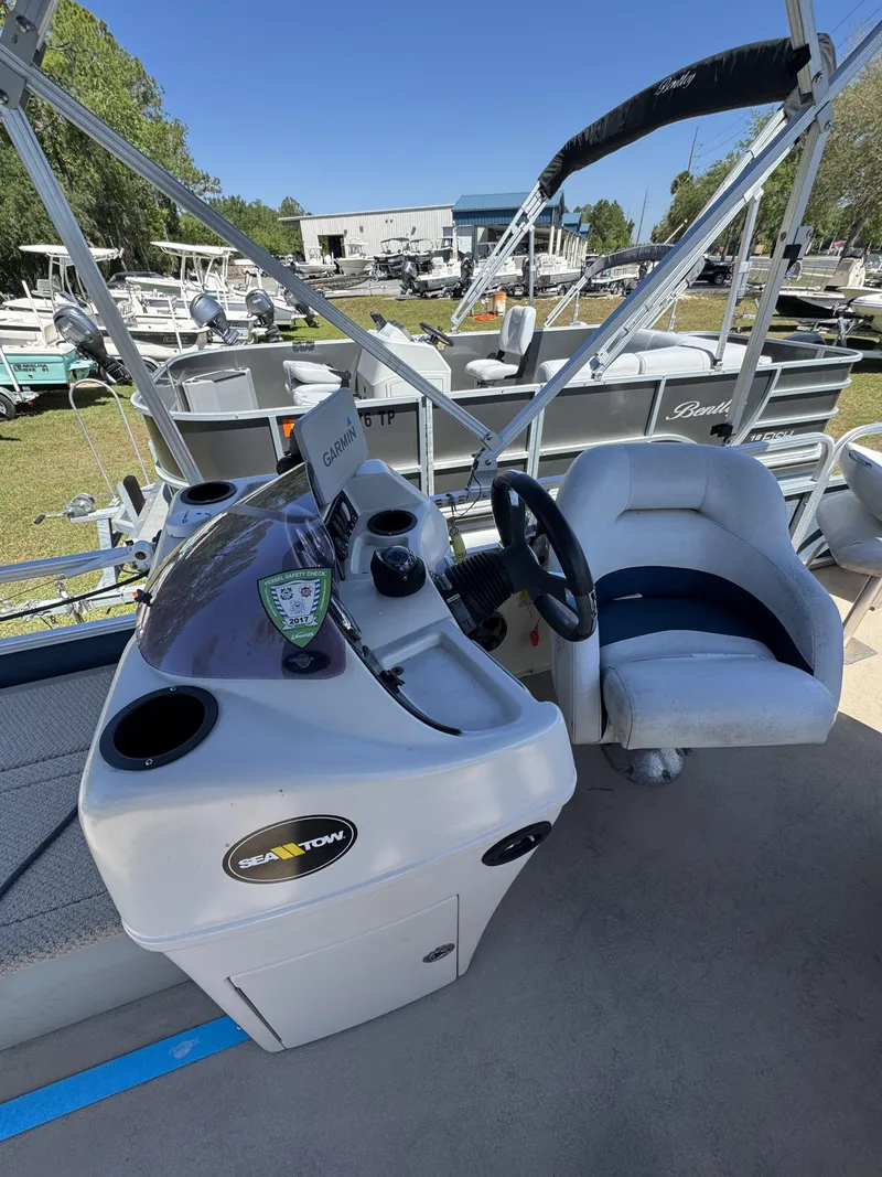 Slide: The Image of Helm of a 2013 Lowe X214 Fish boat outdoors. - 15