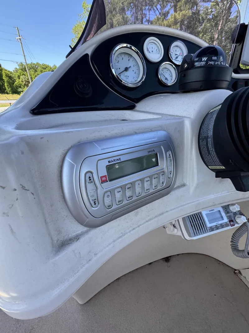 Slide: The Image of Dashboard of a 2013 Lowe X214 Fish boat with marine radio. - 16