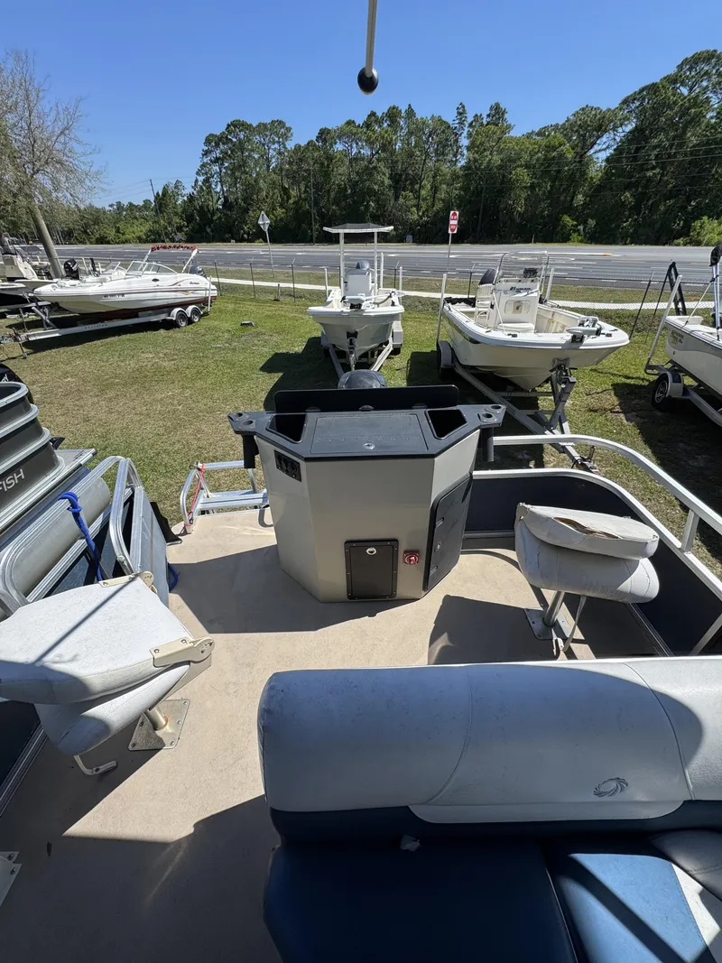 Slide: The Image of Interior view of a 2013 Lowe X214 Fish boat on a lot. - 18