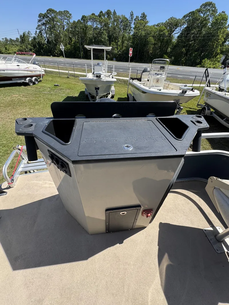 Slide: The Image of 2013 Lowe X214 Fish boat parked on a trailer. - 20