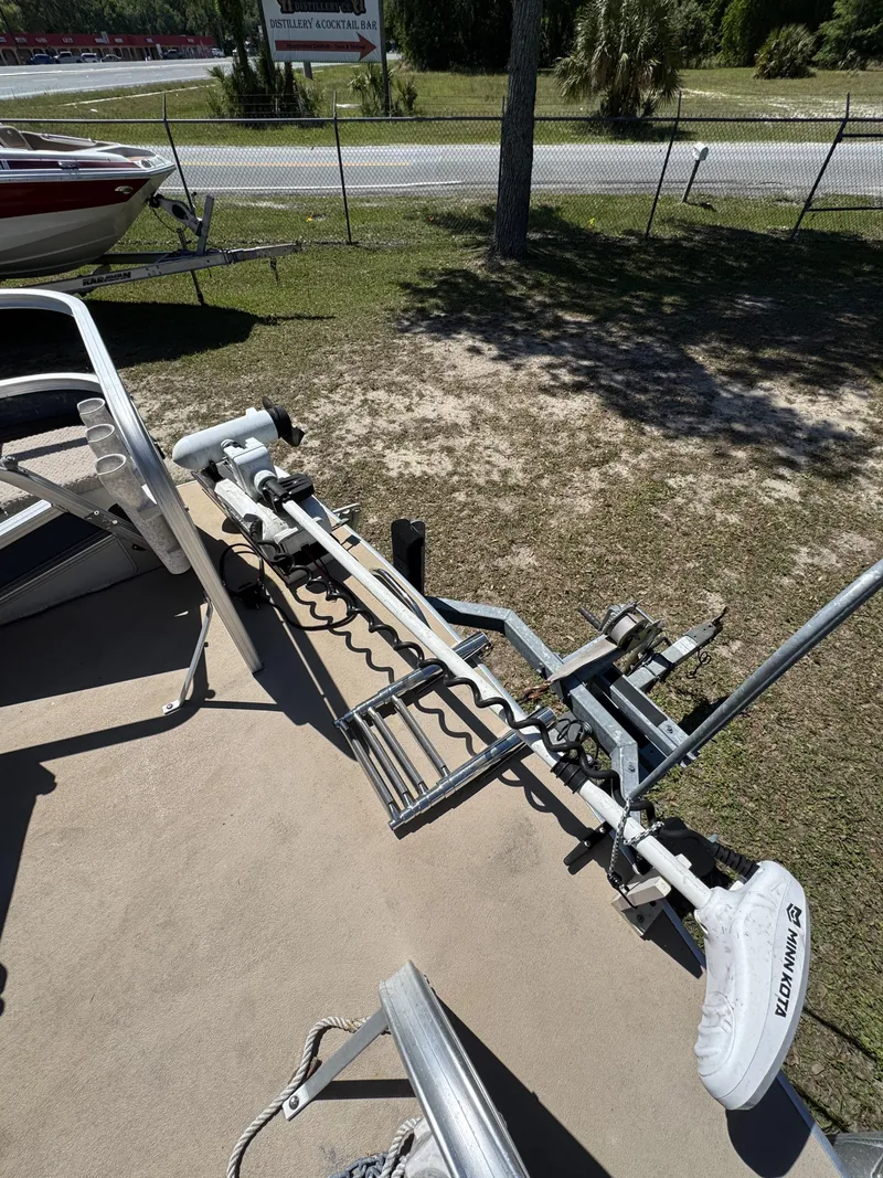 Slide: The Image of Lowe X214 Fish 2013 with Minn Kota trolling motor on trailer. - 24