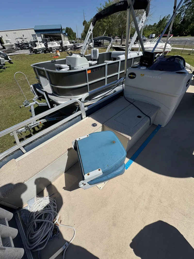 Slide: The Image of Lowe X214 Fish 2013 boat on a trailer outdoors. - 28