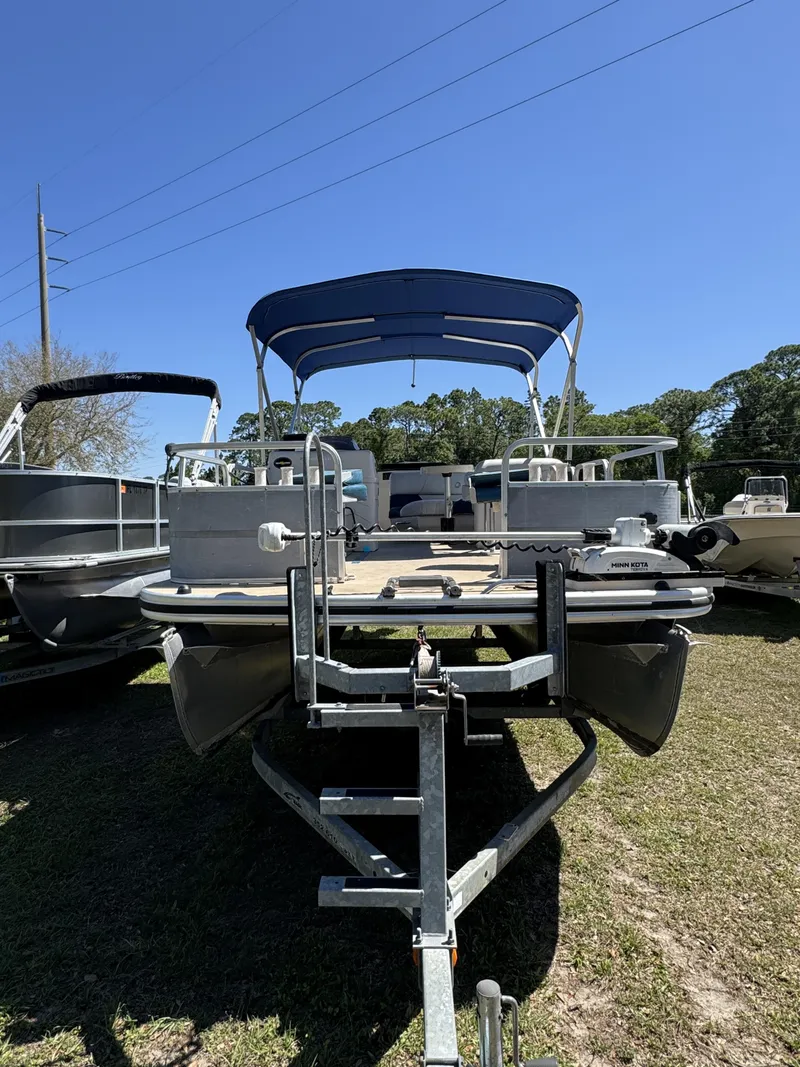 Slide: The Image of 2013 Lowe X214 Fish boat on trailer, blue sky. - 3