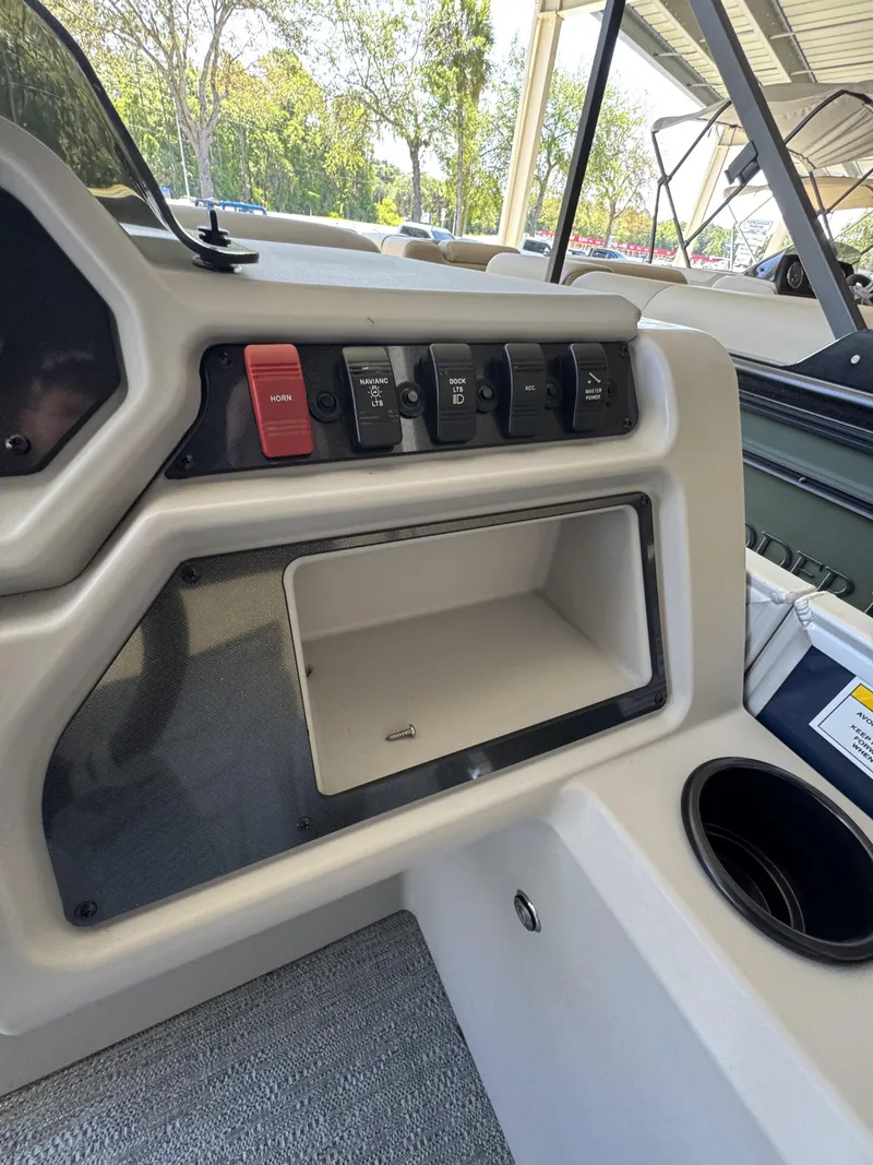 Slide: The Image of Interior view of Sweetwater EX2086SBX 2026 with switches and storage compartment. - 12